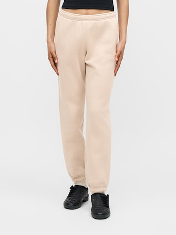 Tapered Pantaloni de la Nike Sportswear pe bej: față