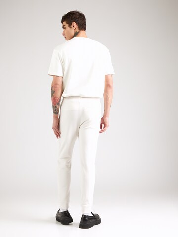 Tapered Pantaloni 'Doak' di HUGO in bianco