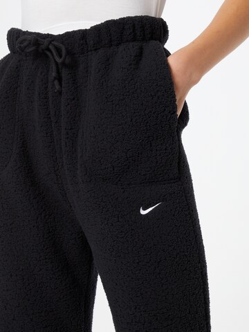 NIKE - Tapered Calças de desporto em preto