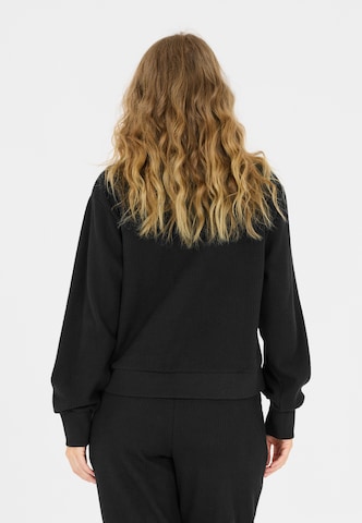 Athlecia Sports sweatshirt in Black
