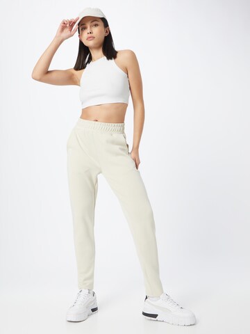 Effilé Pantalon de sport Athlecia en beige