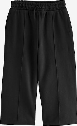 juoda Next Plačios klešnės Kelnės: priekis