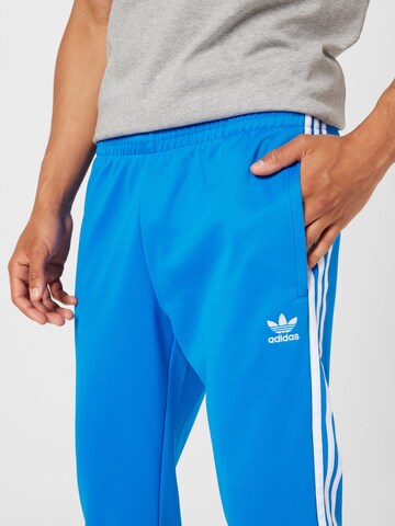 ADIDAS ORIGINALS Tapered Broek 'Adicolor Classics Sst' in Blauw