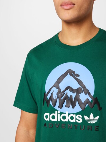 ADIDAS ORIGINALS Tričko 'Adventure Mountain Front' – zelená