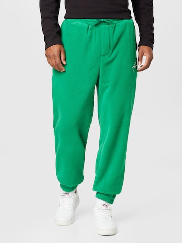 Tommy Jeans Zwężany krój Spodnie w kolorze zielony: przód