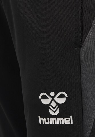 Hummel Slim fit Sports trousers in Black