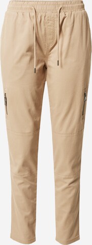 Cartoon Tapered Pants in Beige: front