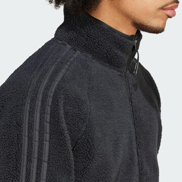 Jachetă  fleece de la ADIDAS ORIGINALS pe negru