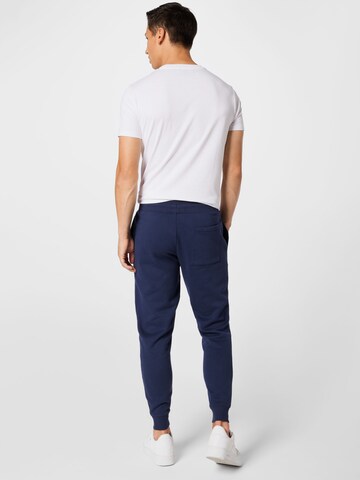 Tapered Pantaloni de la Tommy Jeans pe albastru