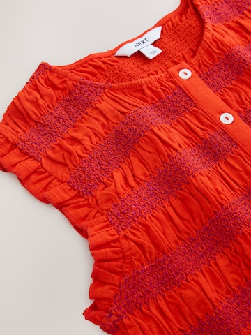 Haut Next en rouge