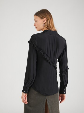 3.1 Phillip Lim - Blusa en negro