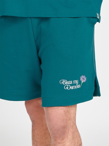 Bless my Demons exclusive for ABOUT YOU Loose fit Trousers 'Cornflower' in Green