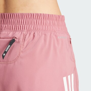 regular Pantaloni sportivi 'Own the Run' di ADIDAS PERFORMANCE in rosso