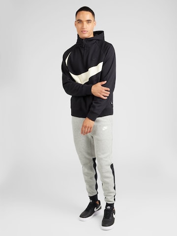 Nike Sportswear Tapered Byxa 'TECH FLEECE' i grå