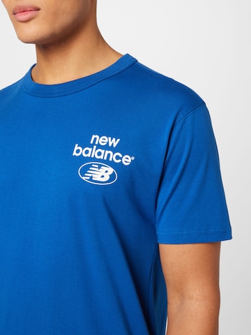 new balance قميص بلون أزرق