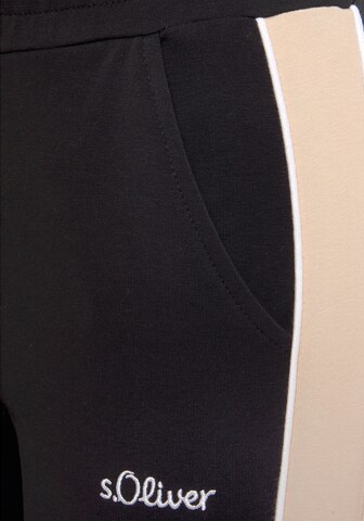 Tapered Pantaloni di s.Oliver in nero