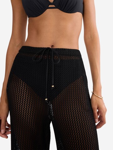 TRIUMPH Loose fit Trousers ' Red Label Beach MyWear ' in Black