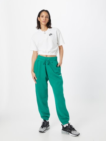 Nike Sportswear Zwężany krój Spodnie 'Phoenix Fleece' w kolorze zielony