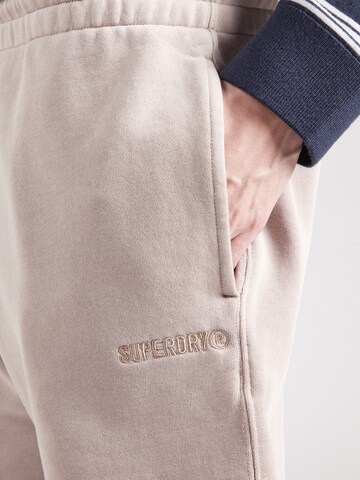 Superdry Свободный крой Штаны в Бежевый