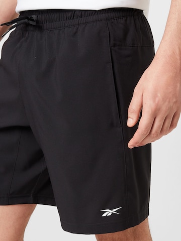 Reebok Normalny krój Spodnie sportowe 'Workout Ready' w kolorze czarny
