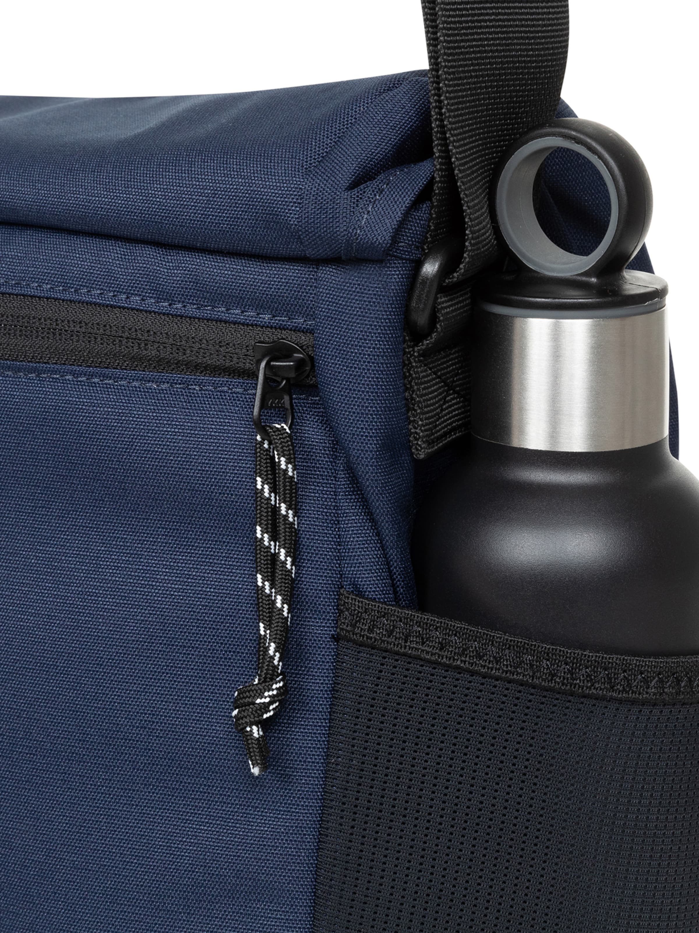 mėlyna EASTPAK „Messenger“ stiliaus rankinė 'Courier Pro'