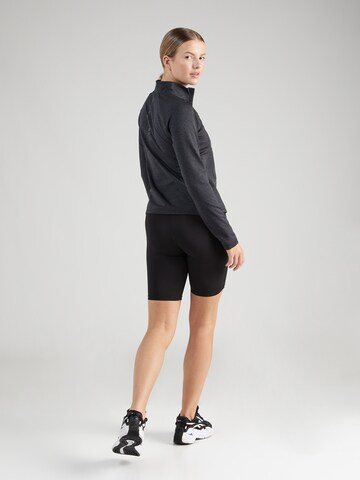 SKECHERS - Camiseta deportiva 'ULTRA GO' en negro