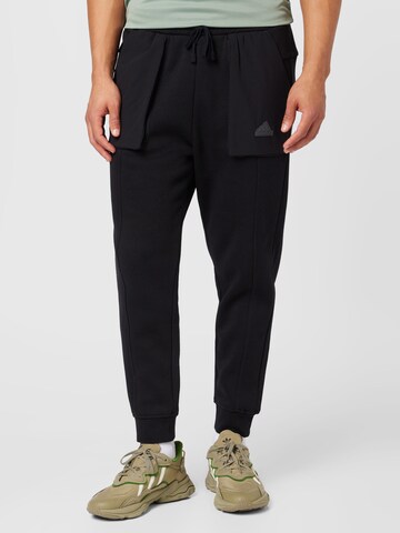 ADIDAS SPORTSWEAR Tapered Sportbroek 'City Escape' in Zwart: voorkant