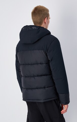 Champion Authentic Athletic Apparel Winter Jacket in Black: front