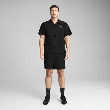 PUMA Comfort fit Functioneel shirt 'Wardrobe Ess' in Zwart