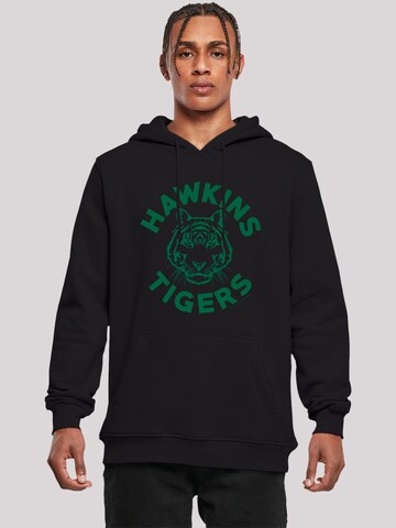 F4NT4STIC Sweatshirt 'Stranger Things Hawkins Tigers Netflix TV Series' in Schwarz: predná strana