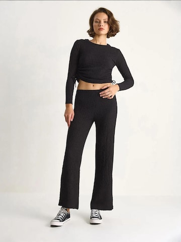 Pantalons de tailleur Bianco Lucci en noir