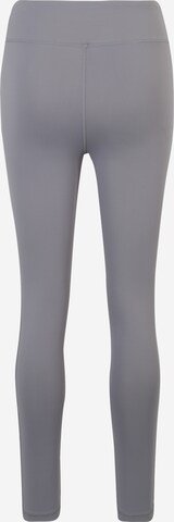 Skinny Pantaloni sportivi di CURARE Yogawear in grigio