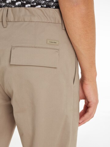 Calvin Klein Regular Pleat-Front Pants in Beige