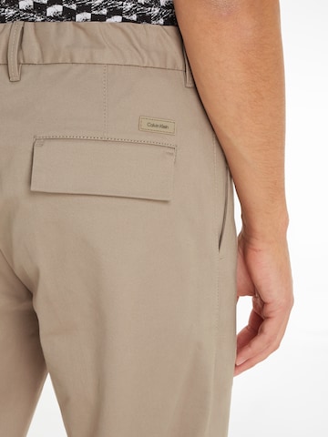 Calvin Klein Regular Pleat-Front Pants in Beige