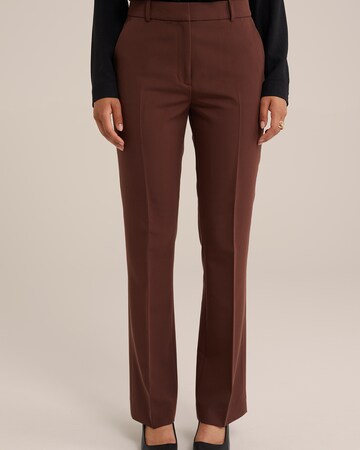 WE Fashion Boot cut Trousers in Brown: front