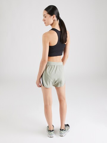 UNDER ARMOUR Skinny Sportbroek 'Fly By 2.0' in Groen