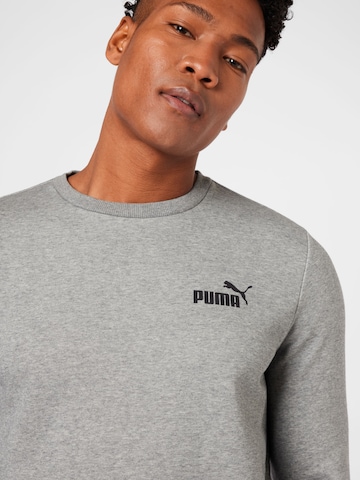 PUMA - Sweatshirt de desporto 'Essentials' em cinzento