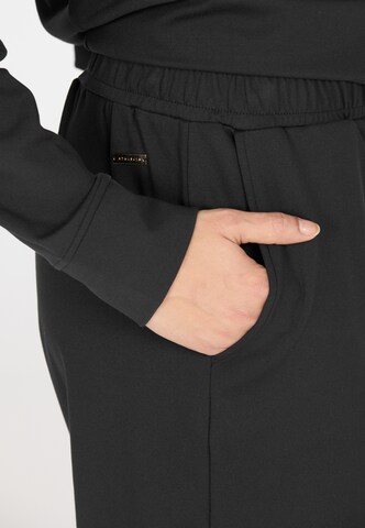 Athlecia Regular Sports trousers in Black