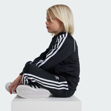 ADIDAS ORIGINALS Juoksupuku 'Adicolor' värissä musta