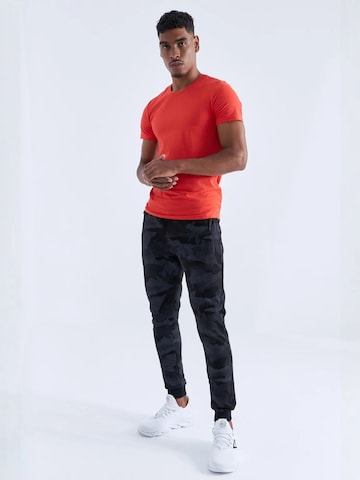Skinny Pantaloni sportivi di Tommy Life in nero