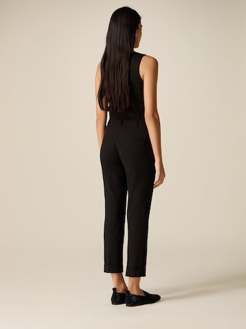 oltre - Tapered Pantalón en negro