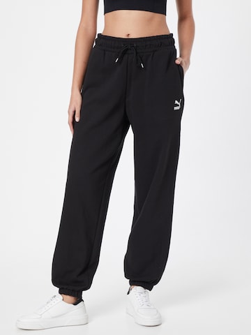 PUMA - Tapered Calças em preto: frente