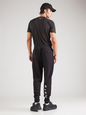 Regular Pantaloni sport de la PUMA pe negru