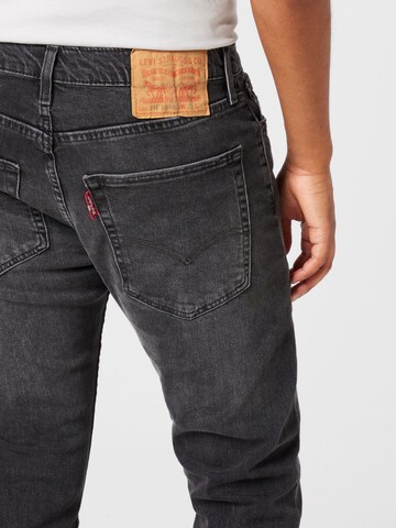 LEVI'S ® Avsmalnet Jeans i grå