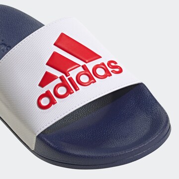 balta ADIDAS SPORTSWEAR Sandalai / maudymosi batai 'Adilette'