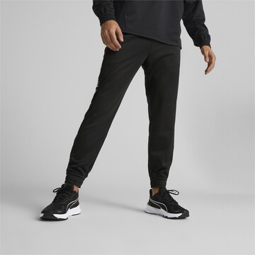 Effilé Pantalon de sport PUMA en noir : devant