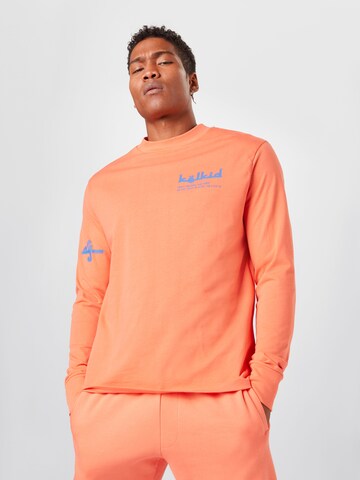 ABOUT YOU x Mero T-shirt 'Kelkid' i orange: framsida