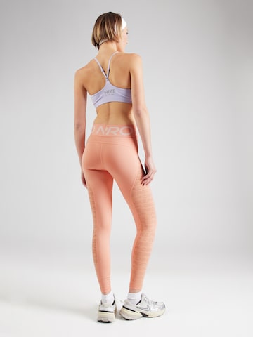 NIKE - Skinny Calças de desporto em laranja