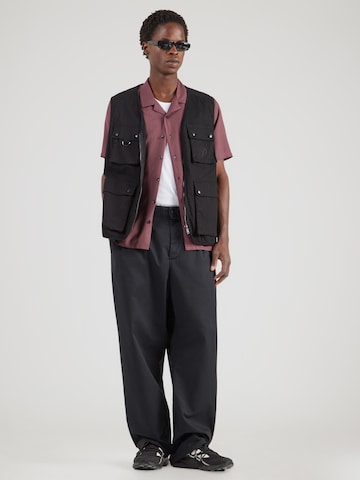 Carhartt WIP Bő szár Élére vasalt nadrágok 'Evan' - fekete