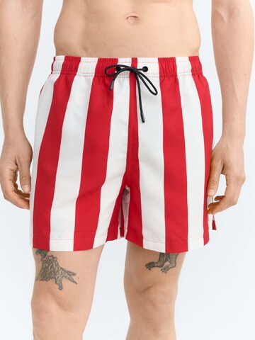 Thinking MU Board Shorts 'Limpopo' in Red: front